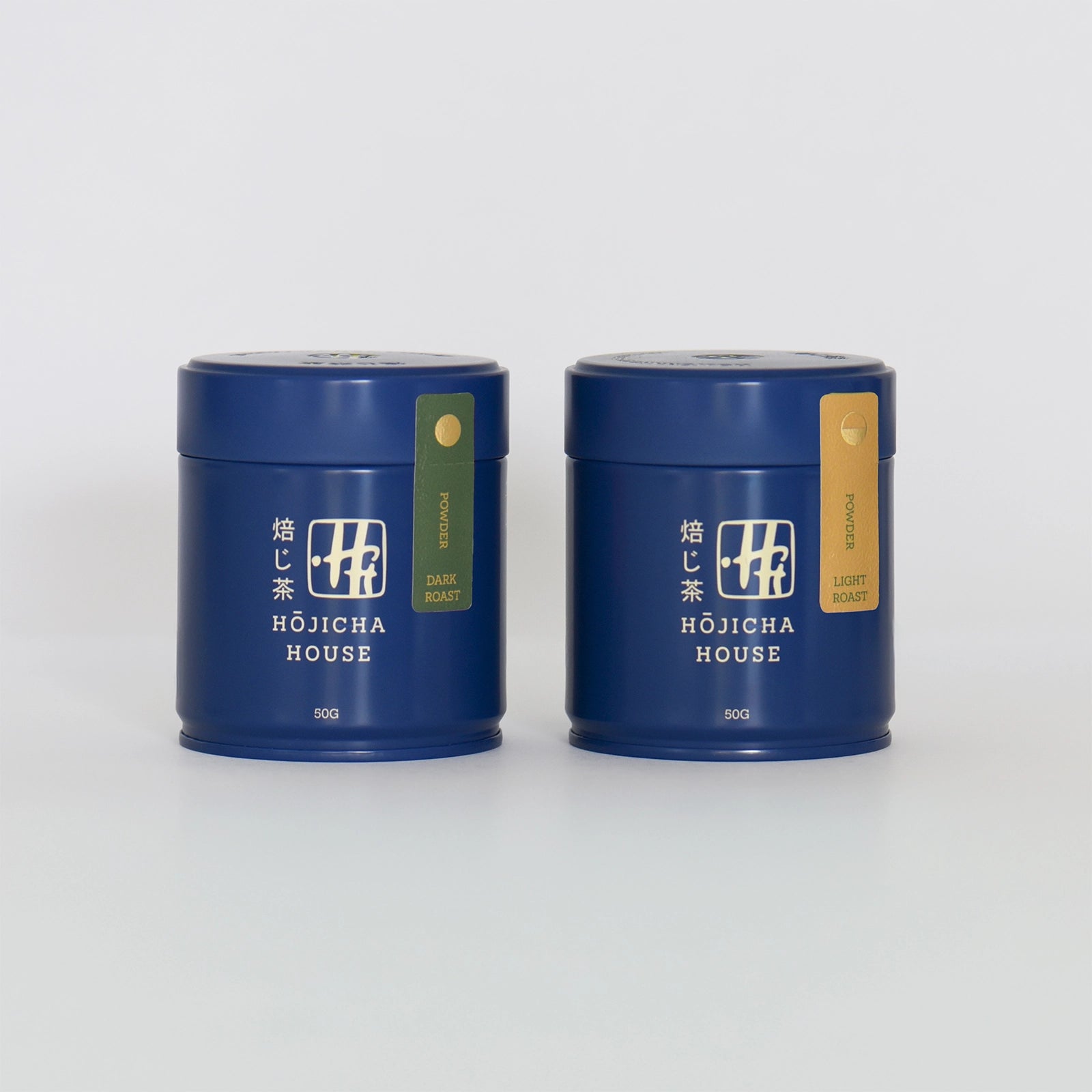 Two blue tea canisters with 'Hojicha House' branding on a white background